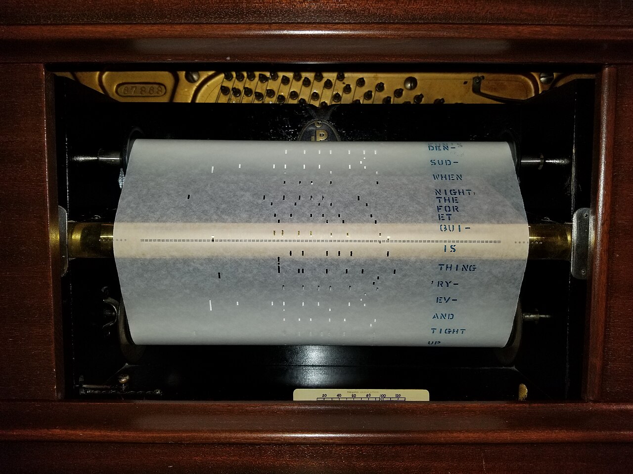Figure 2 — A 110 mm Raffin 20-note busker roll, the de-facto-standard geometry that anchors the scale table (3 mm perforations; melody/bass tracker holes 4 mm/6 mm).