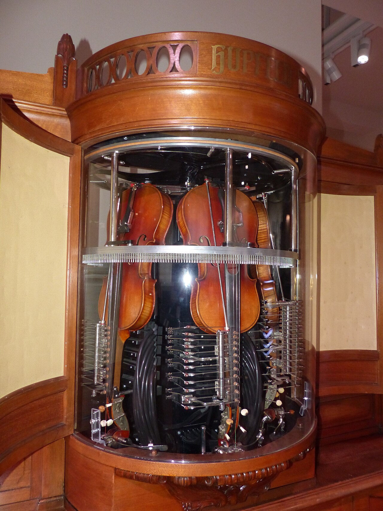 Figure 2 — The Hupfeld Phonoliszt-Violina (from 1907) — a self-playing violin-and-piano orchestrion, with three real violins bowed by a rotating horsehair wheel; the star of the 1910 Brussels World's Fair