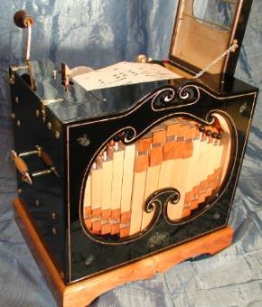 Figure 3 — A home-built John Smith 20-note busker organ, made from ordinary timber and hardware to the freely shared 1995 plans — the design that turned a dying professional craft into a worldwide amateur hobby