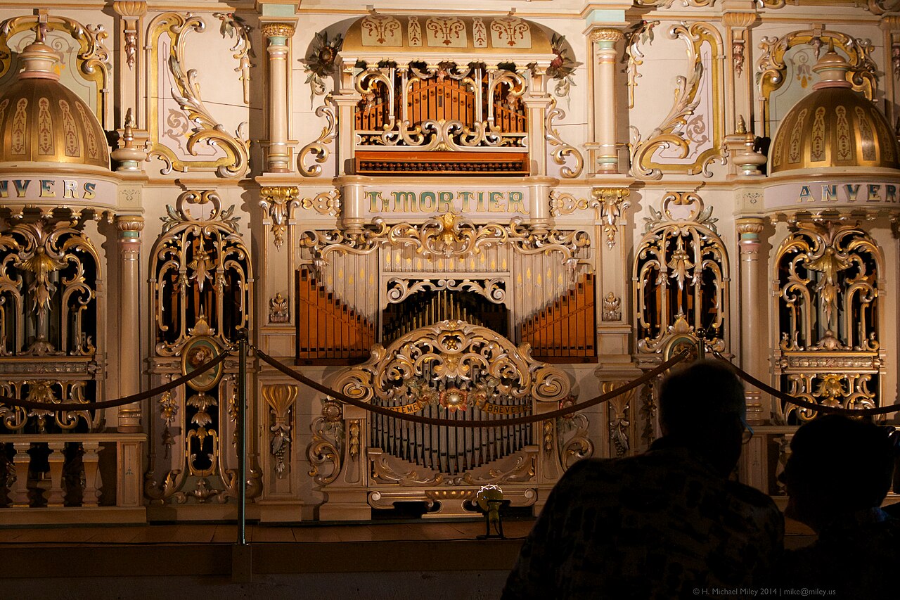 Figure 2 — A Théophile Mortier dance organ from Antwerp, its Art-Deco front of coloured glass and mirror built for the indoor dance hall rather than the open fairground