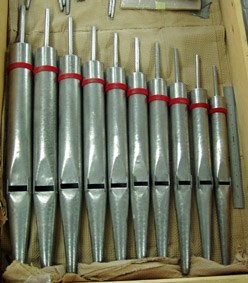 Figure 3 — The pierced caps and soldered chimneys (Röhren) atop metal Rohrflöte (chimney flute) pipes — the small open tube re-admits selected upper and even partials to a stopped body.