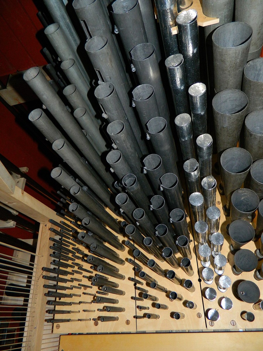 Figure 3 — Tall zinc bass pipes (16′ and pedal ranks) — zinc's rigidity and low cost make it the standard wall material for the largest pipes, usually fitted with a tin/lead mouth and languid.