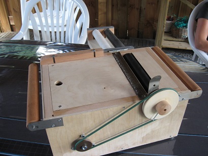 Figure 4 — A shop-built cardboard-book scanner: a windscreen-wiper transport draws the book past an infrared LED/phototransistor sensor bar that reads the slots into a MIDI file.