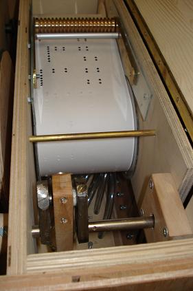 Figure 1 — The brass command block (playing table) and pressure roller of a 20-note Höffle organ — the two precision parts most builders buy finished.