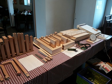 Figure 2 — A home-built 31-note MIDI crank organ (Ulrich Stille plan) on the bench, showing beech pipes and folk-painted case.