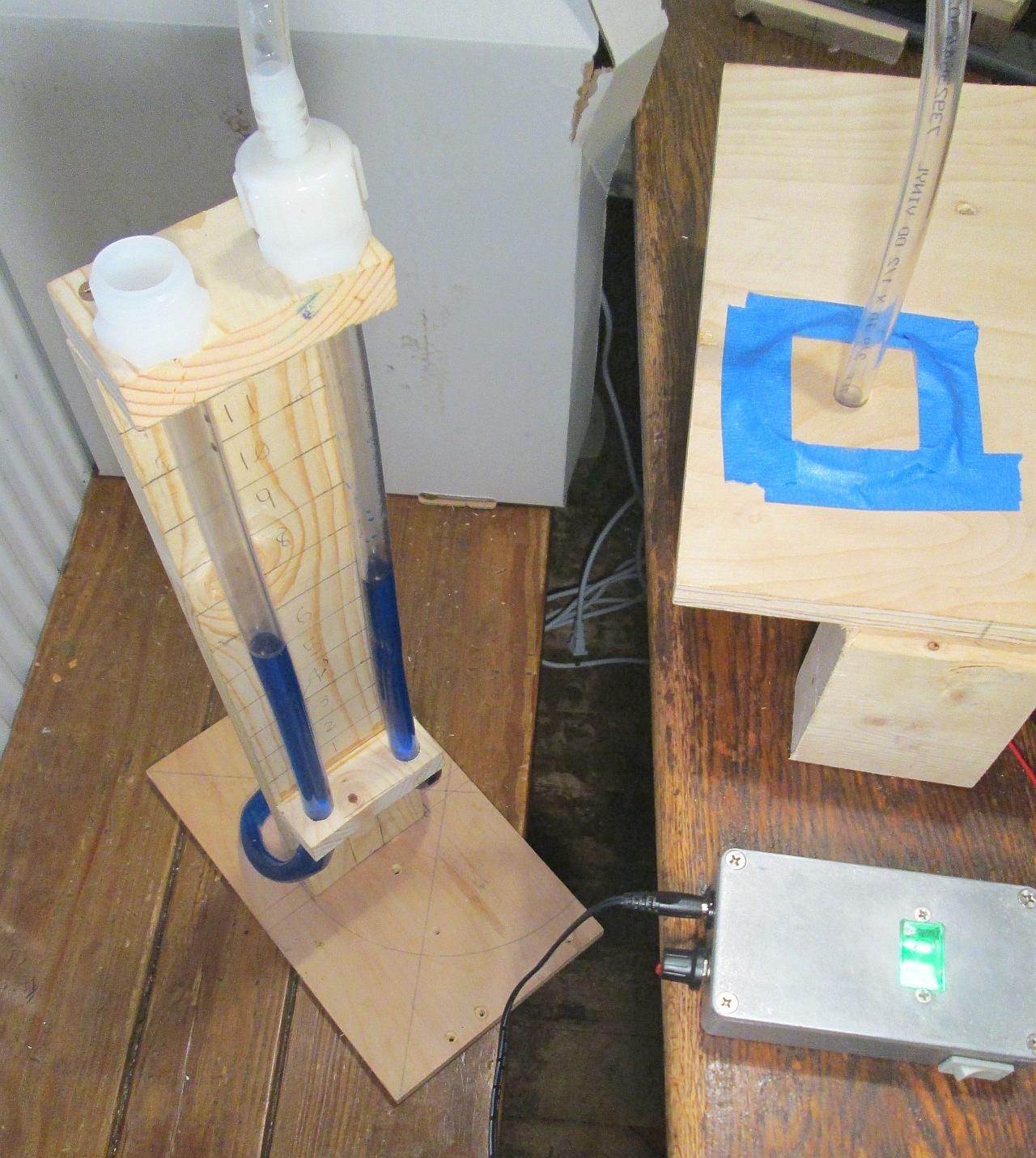 Figure 2 — A U-tube water manometer teed into the wind line of a hobby crank-organ voicing bench