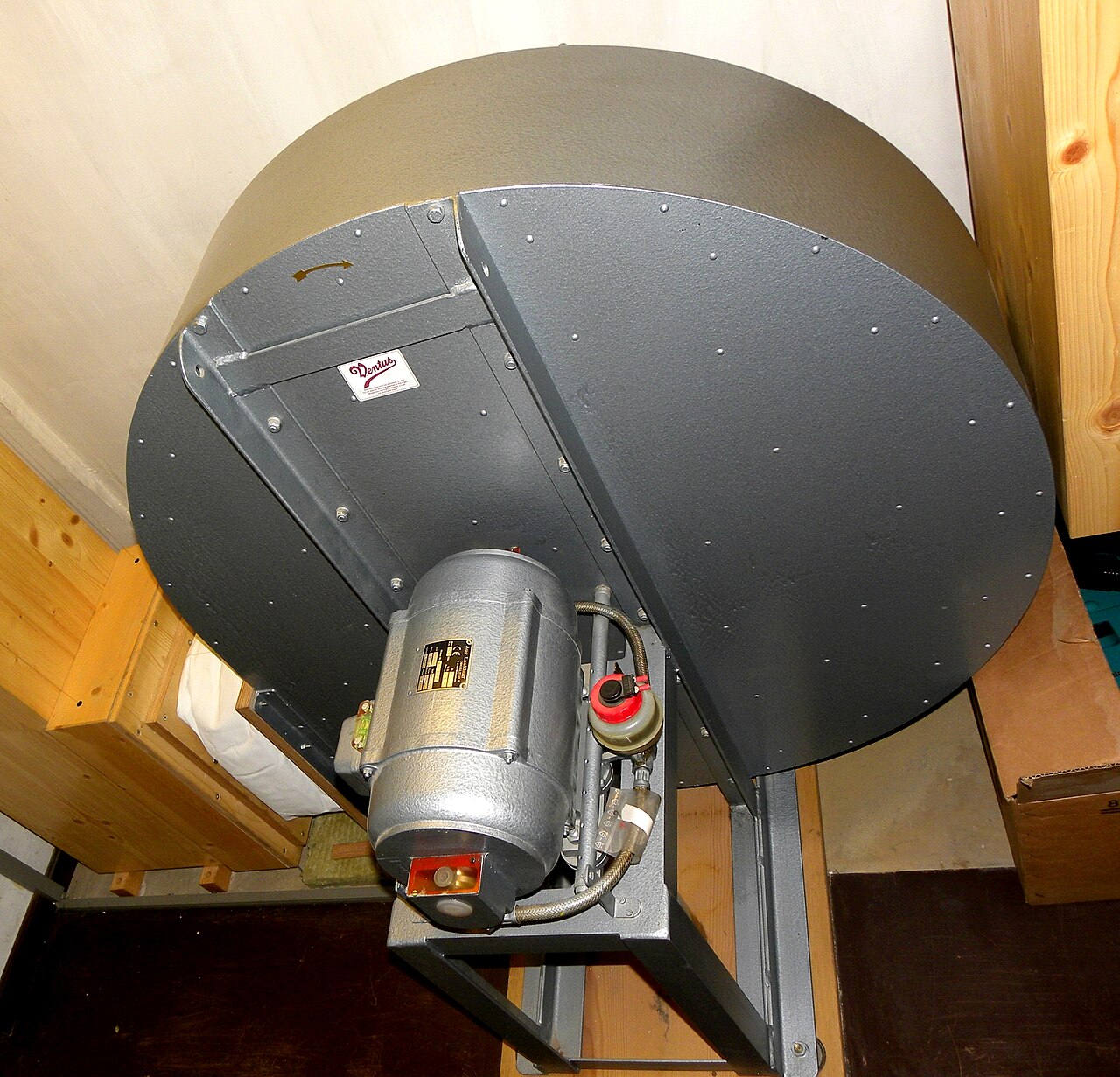 Figure 2 — A modern electric centrifugal organ blower: a motor-driven impeller in a volute casing delivering wind at organ pressure; units like this displaced hand- and foot-blowing after about 1900.