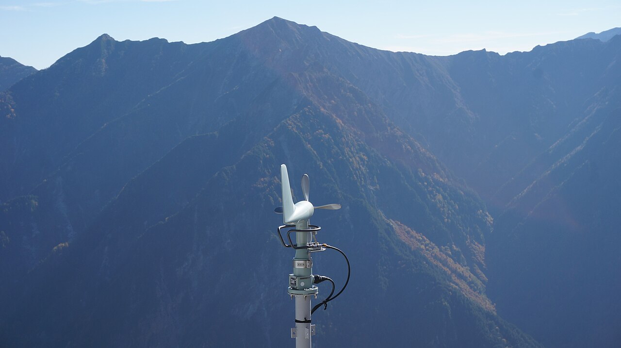 Figure 2 — A vane anemometer measuring air velocity in a duct; multiplied by cross-sectional area it gives volume flow (L/s or CFM), the demand-side counterpart to the manometer's pressure reading when charac…